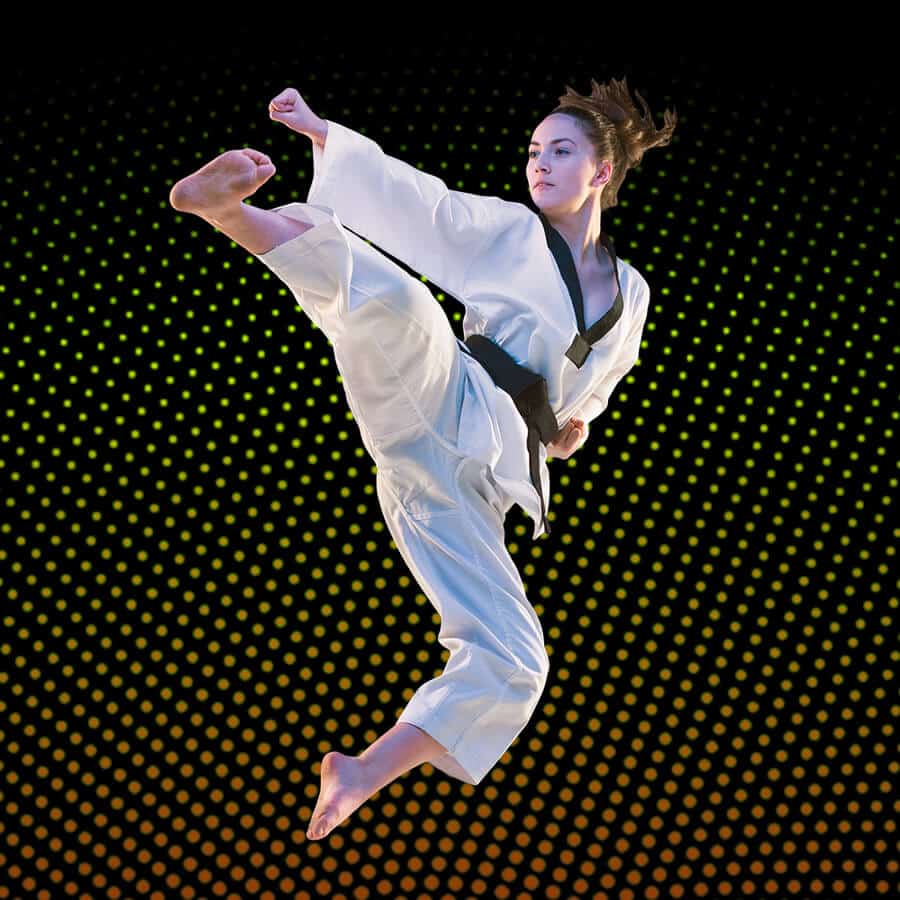 Martial Arts Lessons for Adults in Burlington NJ - Girl Black Belt Jumping High Kick